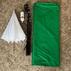 Green screen, light bulb, tripod for bulb, umbrella for lighting.